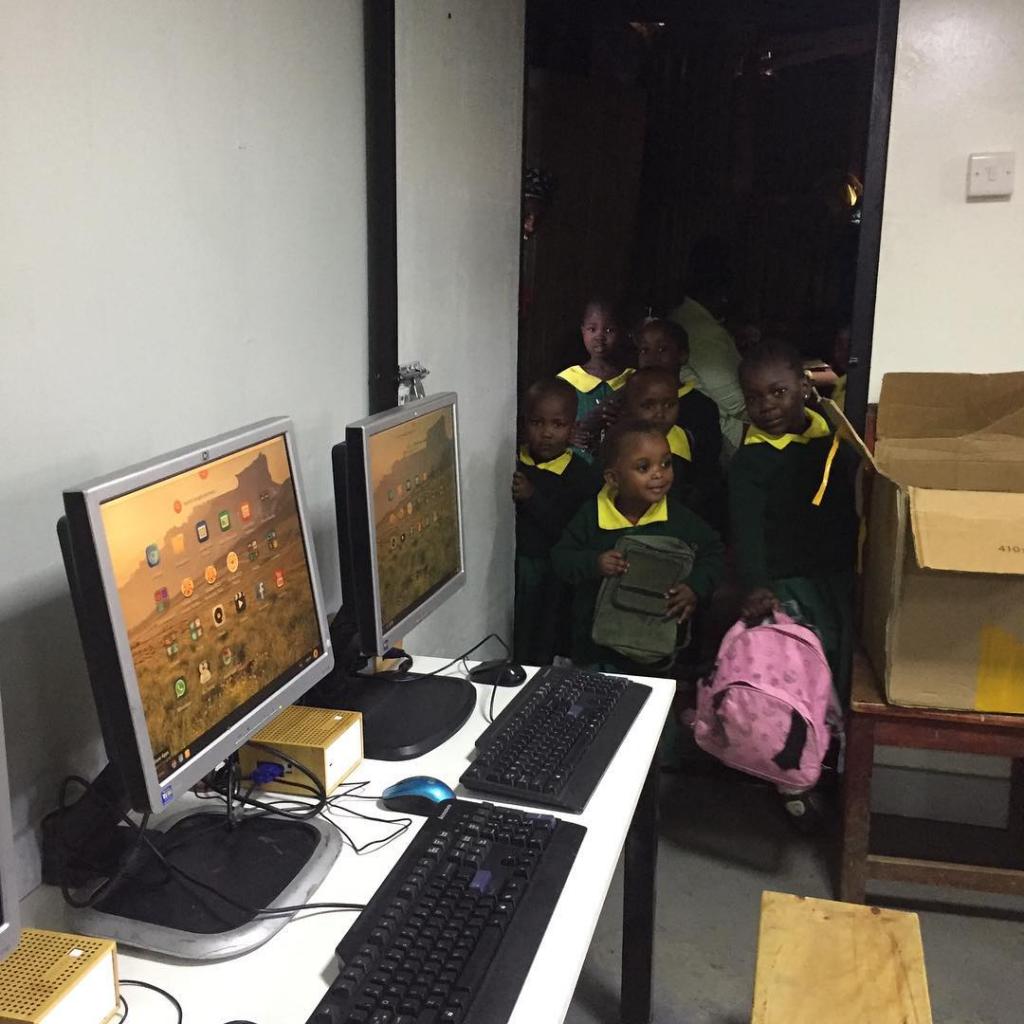 Children waiting to enter the new Malezi School Computer Lab